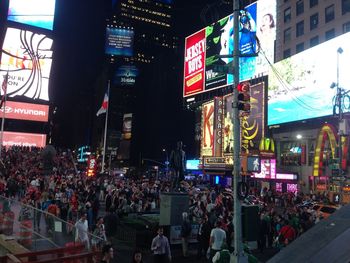 Illuminated city street at night