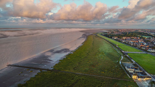 High angle view of street amidst sea against sky