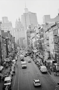 High angle view of city street and buildings against sky