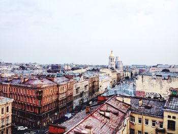 High angle view of buildings in city against clear sky