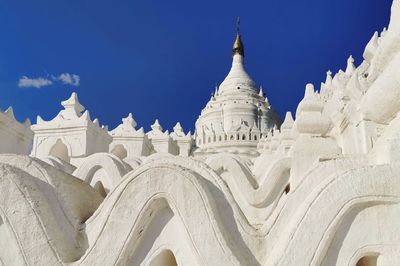 Low angle view of historical building against blue sky