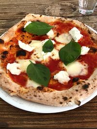 High angle view of pizza in plate on table