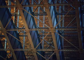 Low angle view of metallic bridge