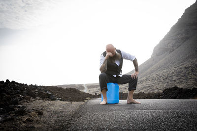 Rear view of man standing on mountain