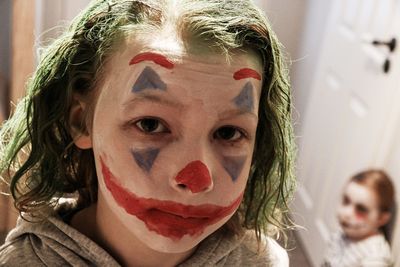 Close-up portrait of girl with face at home