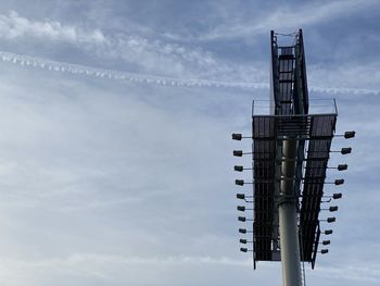 Low angle view of crane against sky