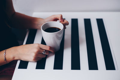 Woman holding coffee cup