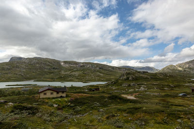 Scenic view of landscape and mountains against sky