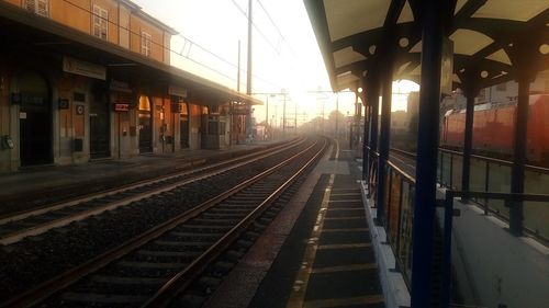 Railroad station platform at sunset