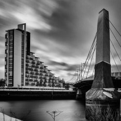 Ship moored in city against sky