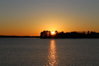 Scenic view of silhouette trees against sky during sunset