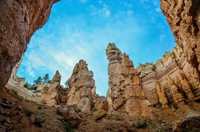 Low angle view of rocks against sky