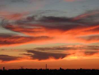 Low angle view of dramatic sky during sunset