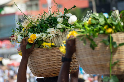 Candomble members are seen carrying a basket of flowers to offer to iemanja 