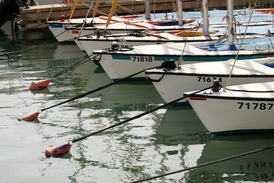 Row of boats moored at harbor