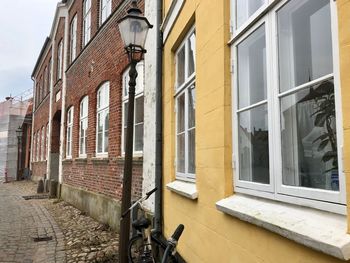 Low angle view of buildings by street