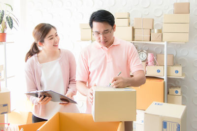 Young couple holding smart phone