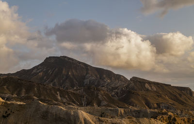 Panoramic view of landscape of tabernas desert in almeria, spain, against cloudy sky