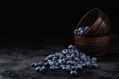 High angle view of fruits on table against black background