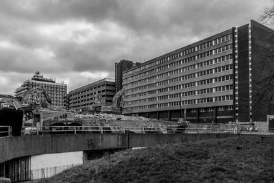 Buildings against cloudy sky