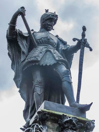 Low angle view of statue against sky