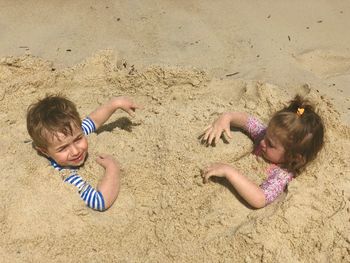 High angle view of children playing on beach