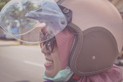 Close-up of woman wearing helmet