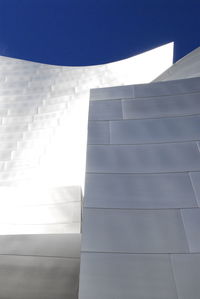 Low angle view of built structure against blue sky