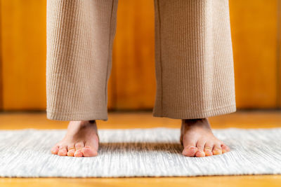 Grounding energy technique. woman standing firmly, focus on feet.