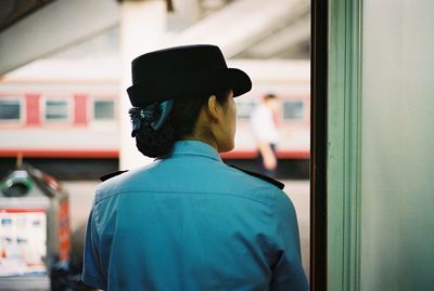 Rear view of man in train