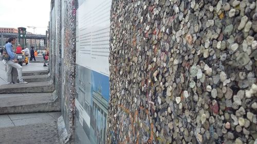 Tilt image of bridge in city against sky