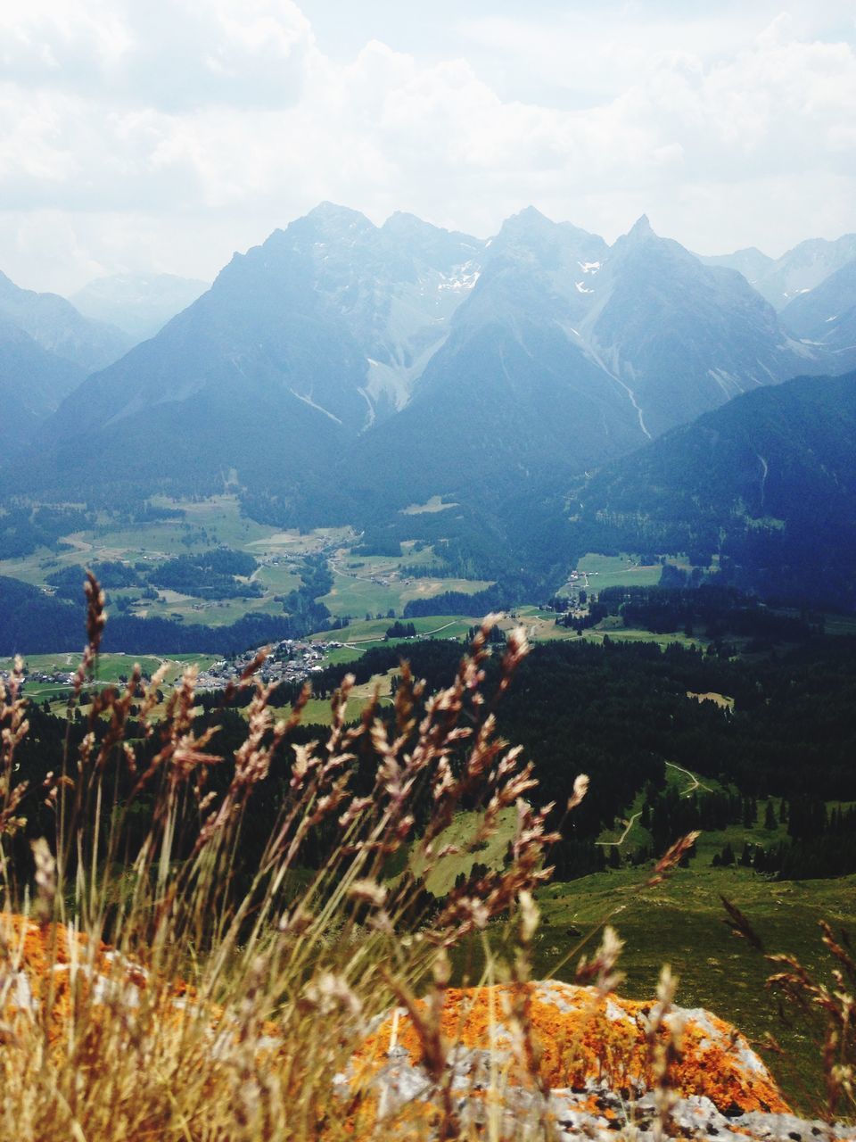 mountain, mountain range, landscape, tranquil scene, tranquility, sky, scenics, beauty in nature, nature, non-urban scene, cloud - sky, rock - object, hill, plant, remote, idyllic, grass, day, outdoors, growth