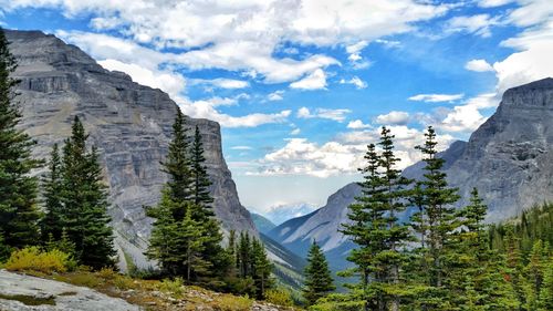 Scenic view of mountains against cloudy sky