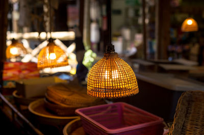 Close-up of illuminated lantern on table