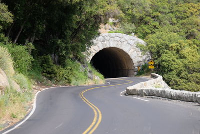 Road leading towards tunnel