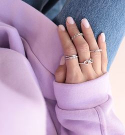 Close-up of woman hand with purple