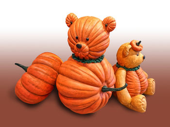 Close-up of pumpkins against white background