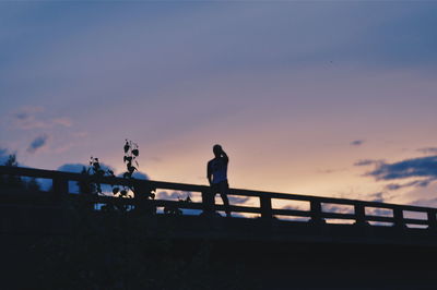 Low angle view of silhouette trees against sky