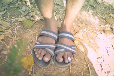 Low section of man standing outdoors