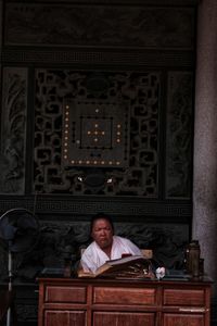 Portrait of man sitting at home