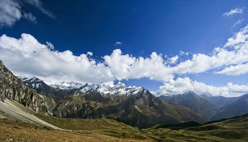 Scenic view of snowcapped mountains against sky