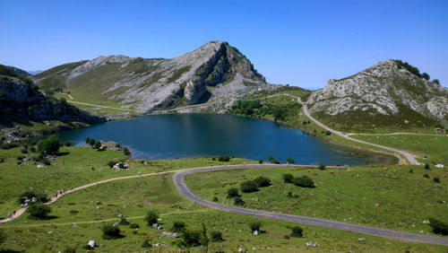 Scenic view of mountains against clear blue sky