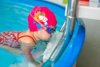 Cute girl at swimming pool