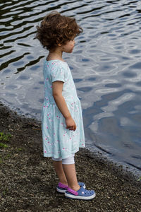 Full length of woman standing in lake