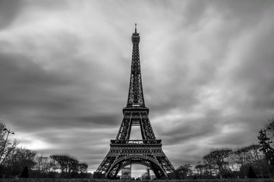 Low angle view of tower against cloudy sky