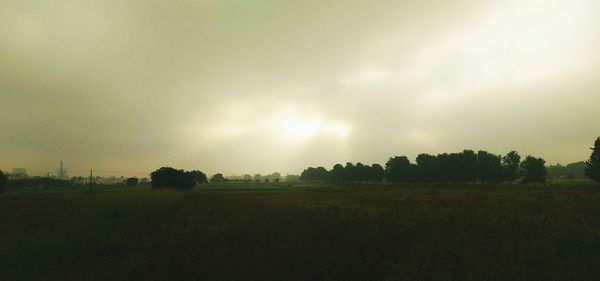 Scenic view of landscape against cloudy sky