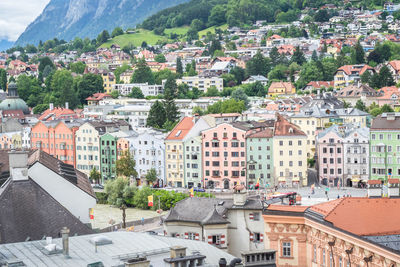 Classic central european light colored buildings along river inn in the city of innsbruck, austria