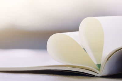 Close-up of heart shape on book