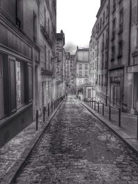 Alley amidst buildings in city