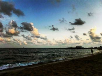 Scenic view of beach against sky during sunset